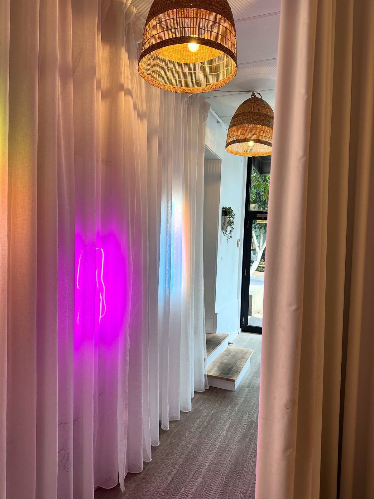 Curtained clinic entry with woven pendant lights